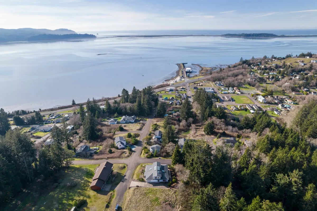 This image presents a sweeping view of the tranquil waterfront, scenic shoreline, and lush greenery—capturing the beauty and serenity of the Tillamook Bay area, which is perfect for pet-friendly walks and outdoor adventures.